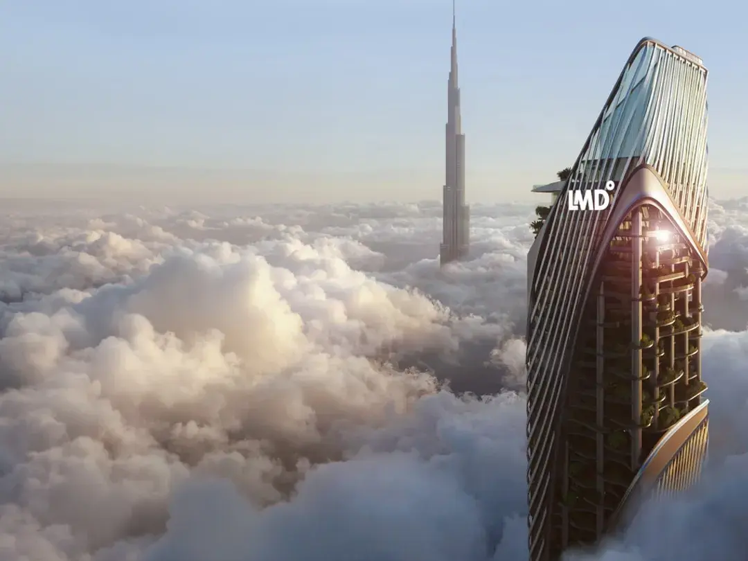 Christian A. Rockefeller Business Tower rising above the clouds, with the Burj Khalifa behind