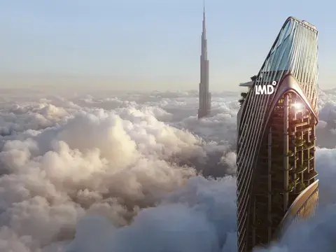 Christian A. Rockefeller Business Tower rising above the clouds, with the Burj Khalifa behind