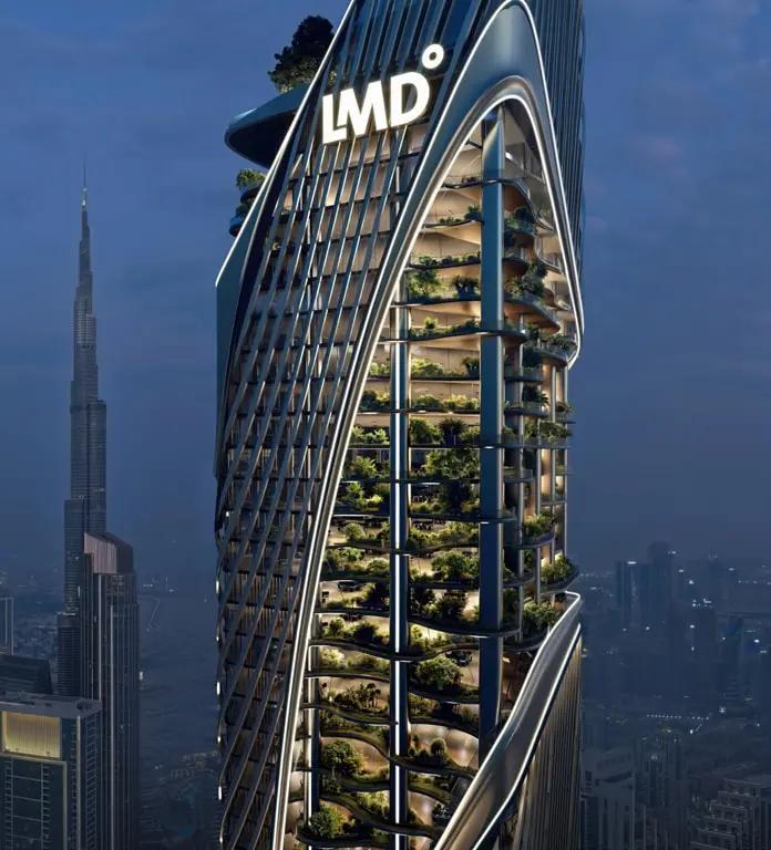 Planted terraces along the tower's curved facade at dusk