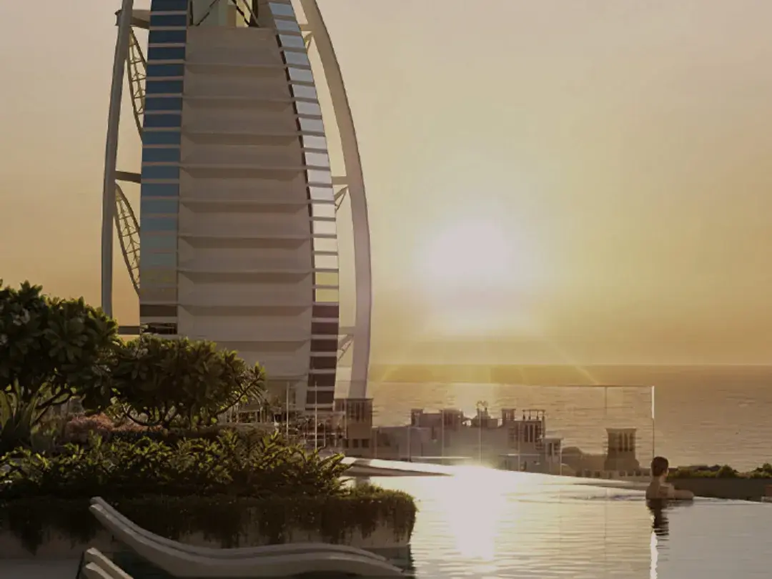 Infinity pool facing the Burj Al Arab at sunset
