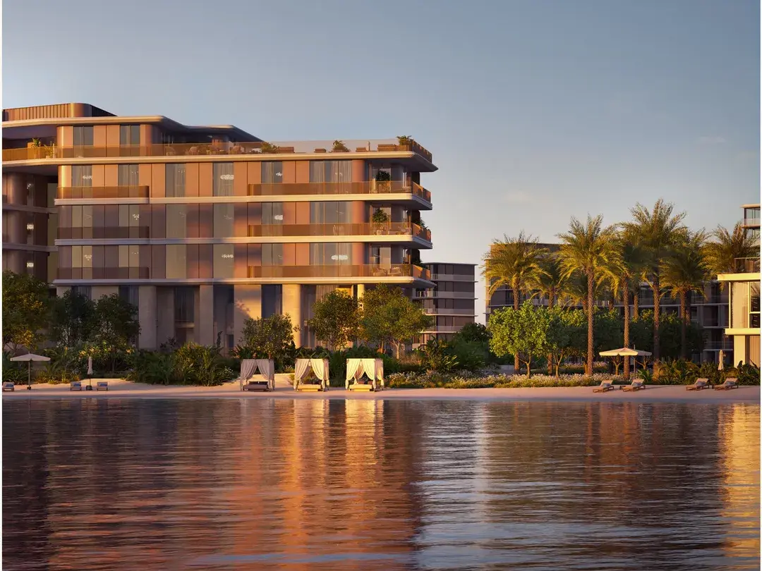Palm Central residences beside the water at dusk