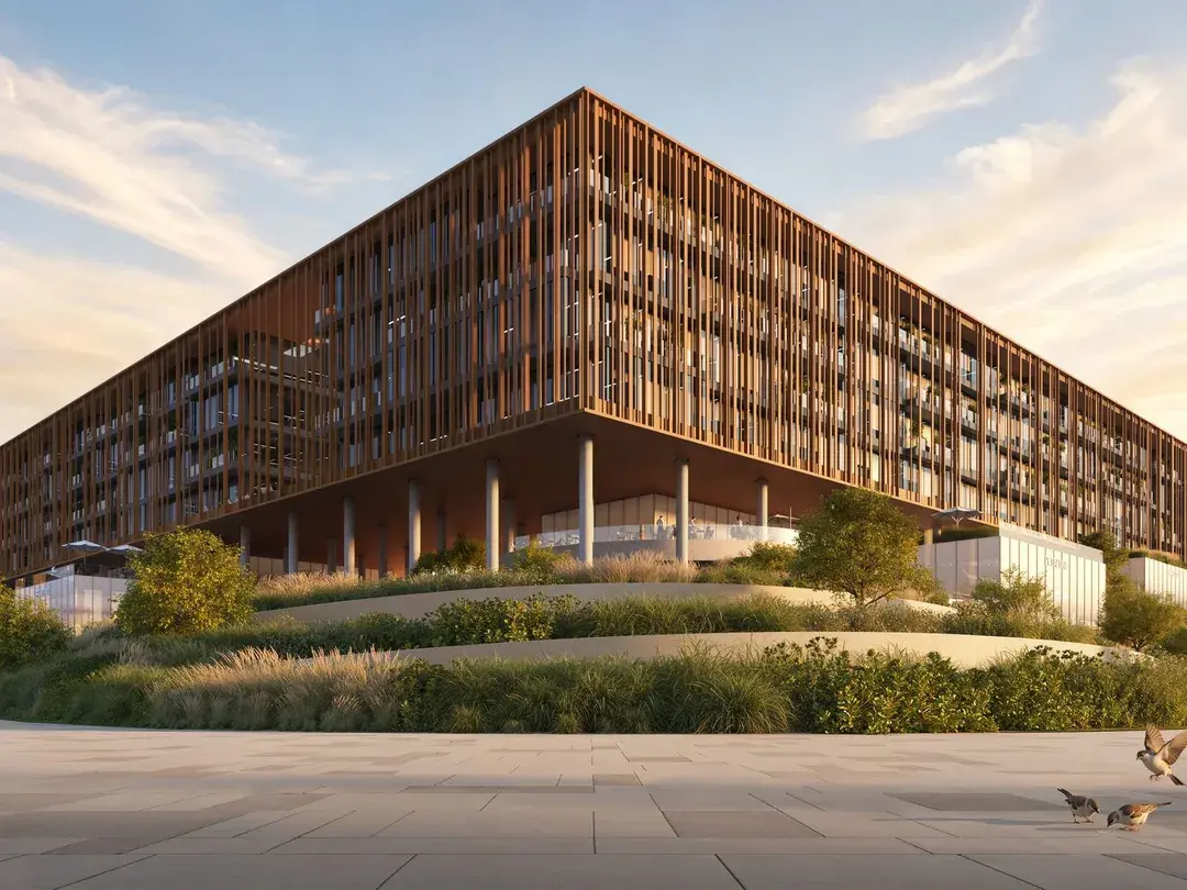 The Yards Plaza at golden hour, with timber-toned louvres above landscaped gardens