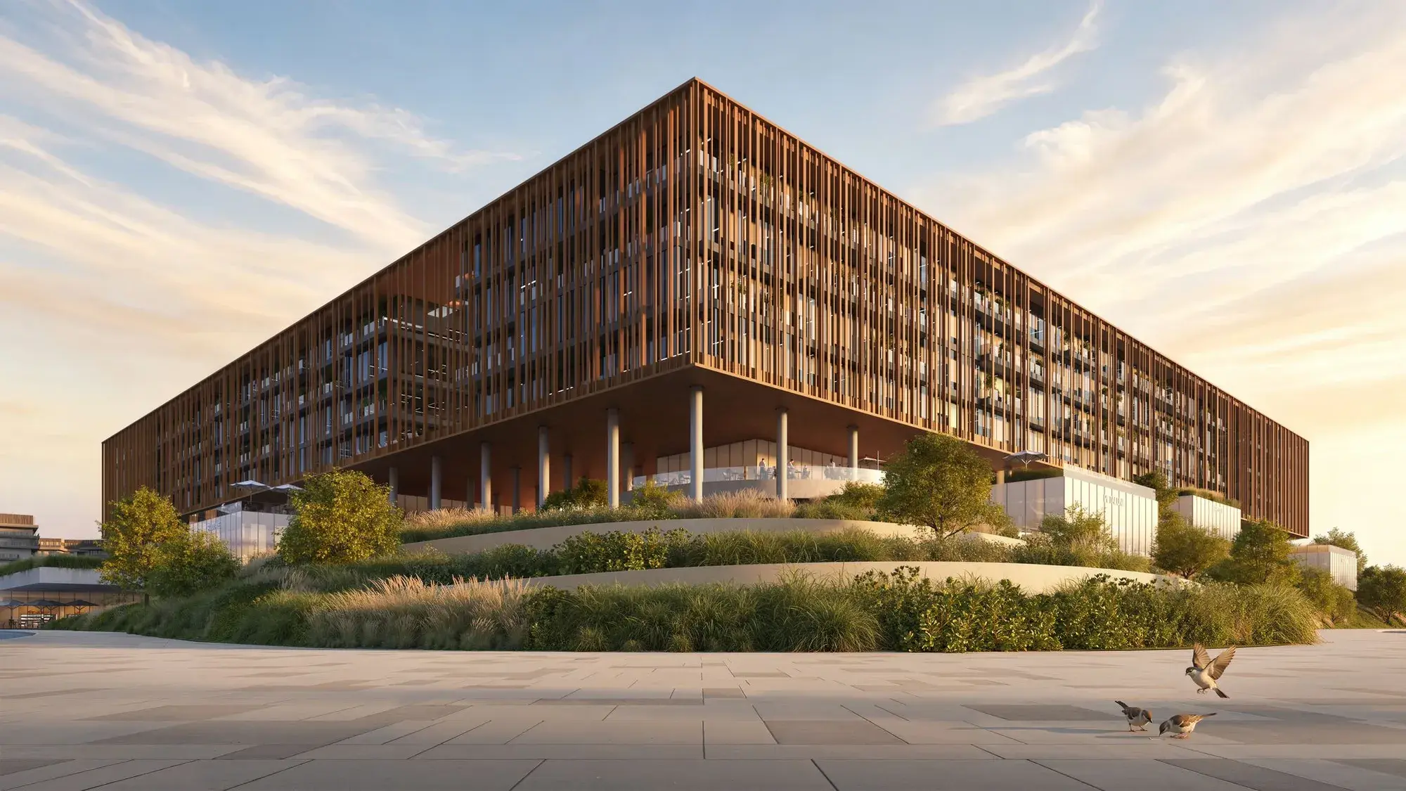 The Yards Plaza at golden hour, with timber-toned louvres above landscaped gardens